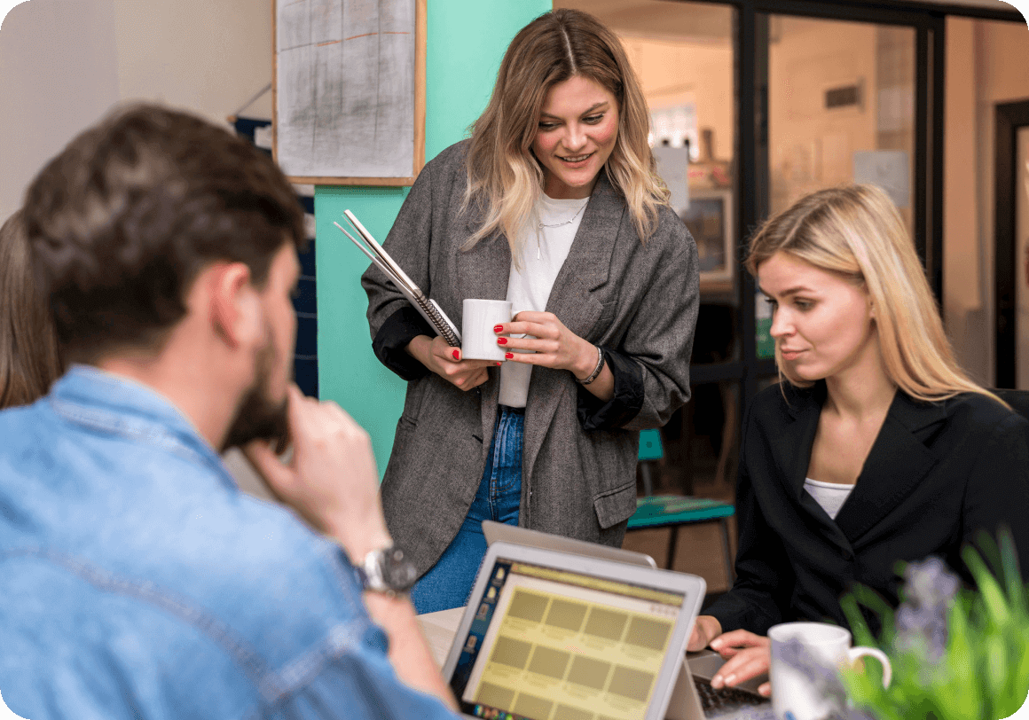 New employee completing onboarding training on tablet with manager guidance in office setting