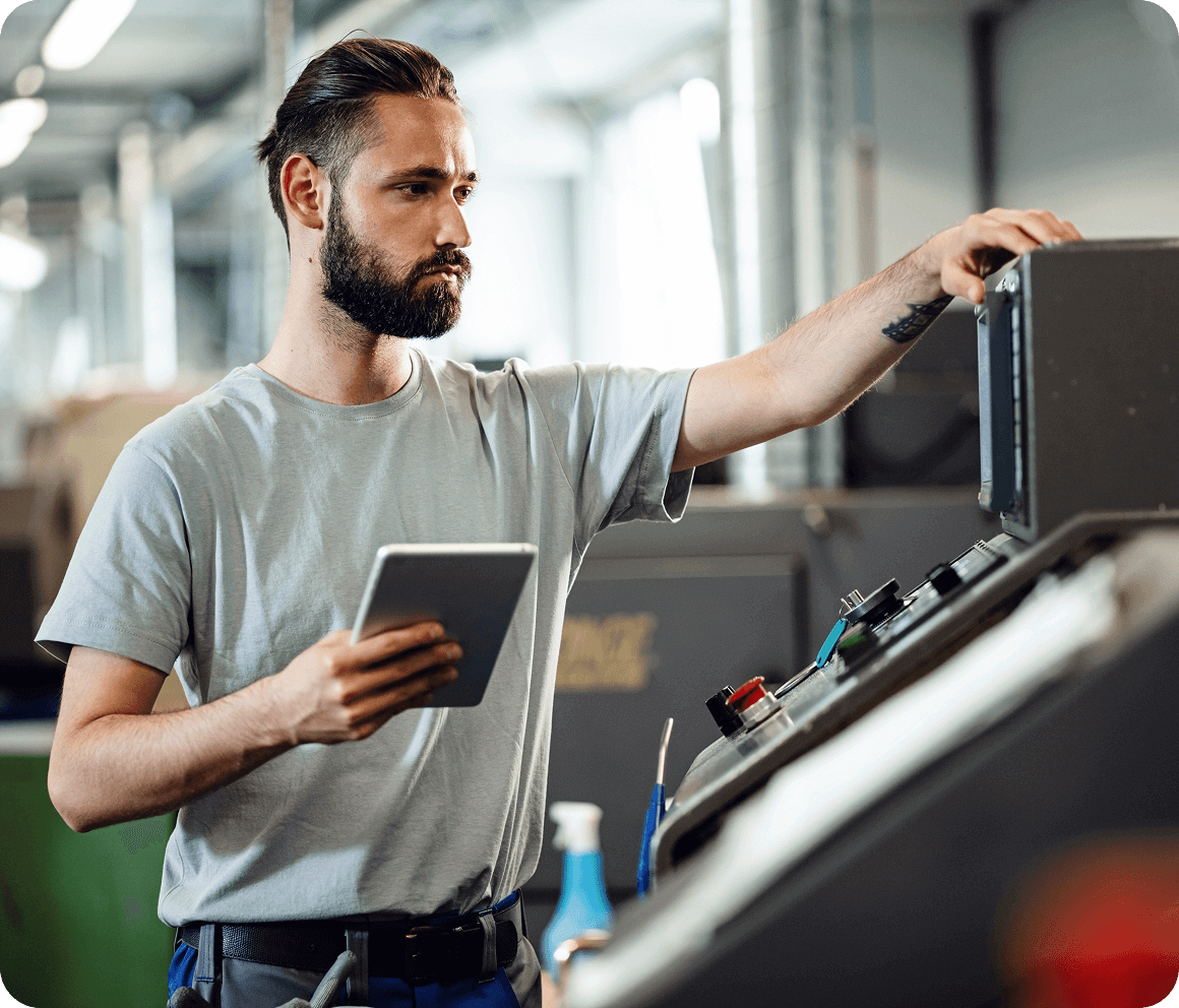 Manufacturing worker learning on tablet for upskilling and continuous education
